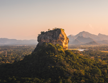 The iconic Sigiriya Rock Fortress rising above the central plains.